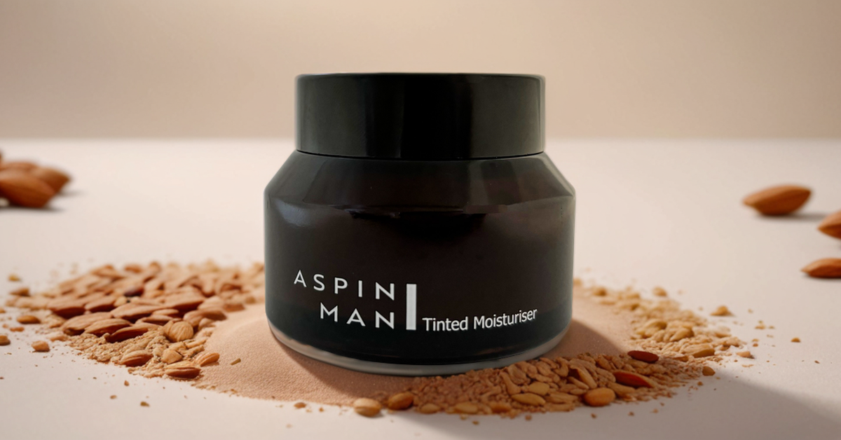 Aspin Man Tinted Moisturizer in a sleek, closed glass jar displayed against a soft cream-colored background with a minimalist, AI-generated aesthetic. The black and white branding of the jar stands out in the clean, neutral setting.